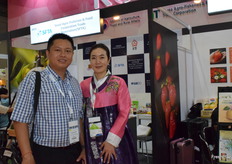 A representative from SFTA is receiving a visitor at the booth.